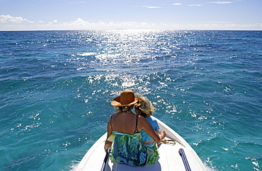 Mother with child on boat, Tonga, South Seas