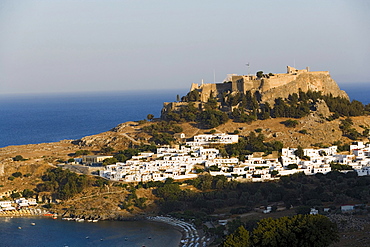 Elevated view of Lindos Bay and town with Acropolis, Lindos, Rhodes, Greece