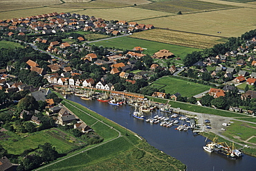 aerial photo of small port of Greetsiel on the river Leybucht in East Frisia, prawn boats, Lower Saxony, northern Germany