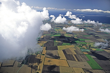 aerial photo of Fehmarn island, patchwork fileds, clouds, Baltic Sea, Schleswig Holstein, northern Germany