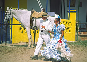 Spain, Andalucia, El Rocio, horse rirs in flamenco style at whitsan festival