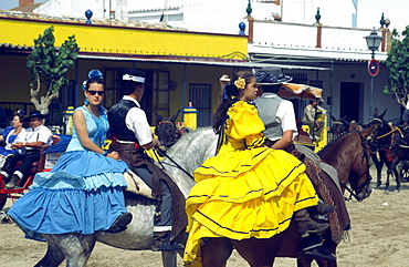 Spain, Andalucia, El Rocio, horse rirs in flamenco style at whitsan festival