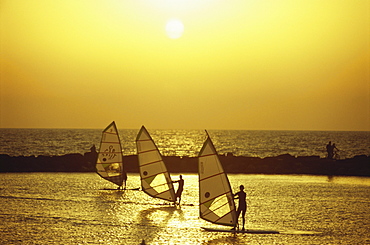 Windsurfers enjoying the sunset in the New Port Area, Tel-Aviv, Israel