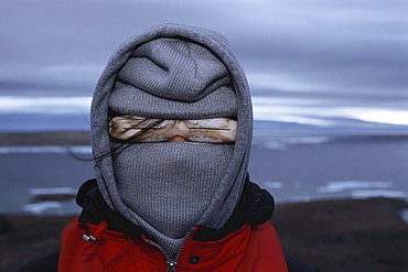 Person wearing Inuit sunglasses, Baffin Island, Nunavut, Canada