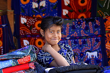 Mexican girl in a woven fabric store in San Lorenzo Zinacantun, Mexico