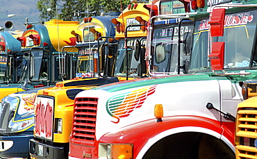 Chicken busses at a bus station, Antigua, Guatemala, Central America