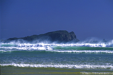 Surf at Mason Bay at dusk, Ernest Islands in the background, Steward Island, New Zealand