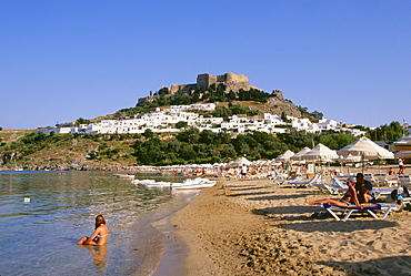 Beach life on Lindos beach, Rhodes Island, Dodecanese, Greece