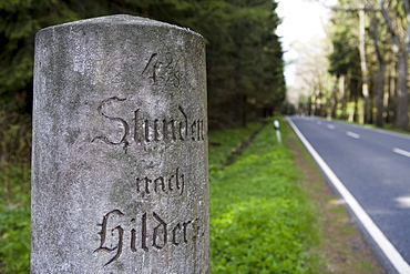 Historic road sign, distance marker stone to Hilders, near Hilders, Rhoen, Hesse, Germany