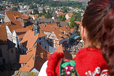 Woman in Traditional Costume Looking at Timberframe Houses in Schlitz, View from Schlitz Tower, Schlitz, Vogelsberg, Hesse, Germany