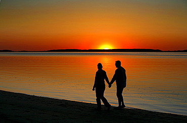 A couple enjoying the sunset, Wellfleet Harbor, Cape Cod, Massachusetts, USA