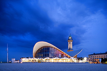 Teepott and lighthouse at night, Rostock-Warnemuende, Baltic Sea, Mecklenburg-Western Pomerania, Germany