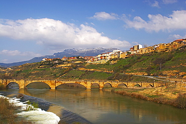 Medieval stone bridge over river, Rio Ebro, in Spring, San Vicente de la Sonsierra, La Rioja, Spain