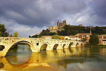 Roman bridge over the river Orb and view of town and cathedral, Beziers, Department Herault, France