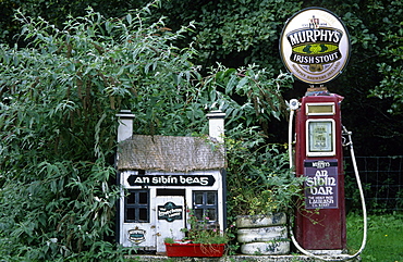 Europe, Great Britain, Ireland, Co. Kerry, old gas station with Murphy's beer sign on top near a pub in Lauragh on the Ring of Beara