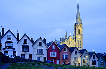 Europe, Great Britain, Ireland, Co. Cork, painted houses in the town centre of Cobh (West View), in the background St. Coleman's cathedral