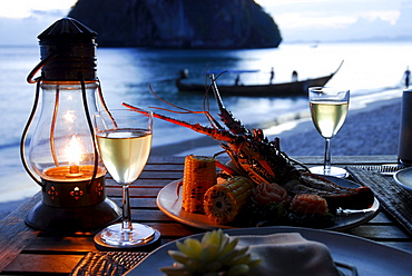 Spiny Lobster dish for romantic Candle Light Dinner at the beach at Beach Restaurant The Grotto in the evening, Hotel Rayavadee, Hat Phra Nang, Krabi, Thailand