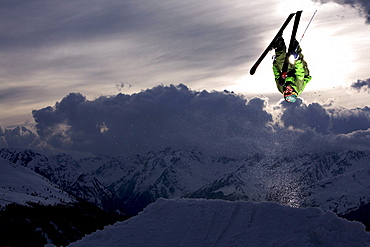 Skier jumping in the sunset, See, Tyrol, Austria