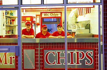 Vendors at an illuinated snack in the evening, Portrush, County Antrim, Ireland, Europe