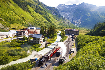 Village and train station of Gletsch, steam train and steam lokomotive of Furka steam mountain railway, Wallis, Valais, Switzerland