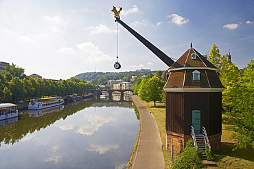 View of crane Saarkran and Old Bridge at the river Saar in the sunlight, Saarbruecken, Saarland, Germany, Europe