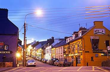 Illuminated street in the evening, Dingle, County Kerry, Ireland, Europe