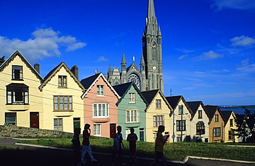 Colourful facades of houses at the Old Town, in the background St. Colman's cathedral, Cobh, County Cork, Ireland, Europe