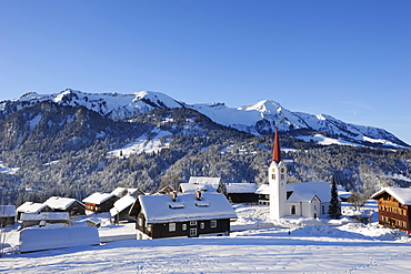 Village of Sibratsgfaell with Allgaeu range in the background, Sibratsgfaell, Vorarlberg, Austria