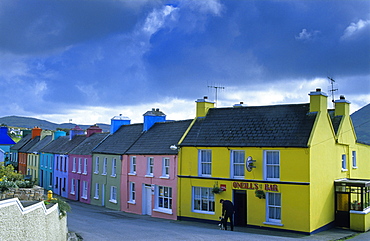 Colourful houses under grey clouds, Eyeries, Beara peninsula, County Cork, Ireland, Europe