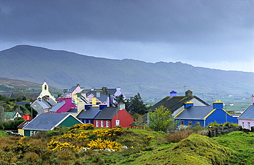 Colourful houses under grey clouds, Eyeries, Beara peninsula, County Cork, Ireland, Europe