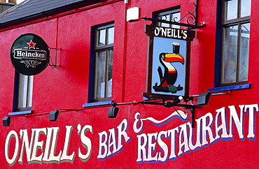 View at the bright red facade of O'Neill's Pub, Allihies, Ring of Beara, County Cork, Ireland, Europe