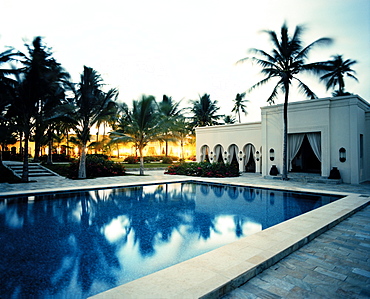 Courtyard with palm trees, Restaurant and Pool of Baraza Spa and Resort in Bwejuu, East Coast, Zanzibar, Tanzania, East Africa