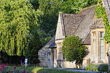 People walking along the river Eye, Lower Slaughter, Gloucestershire, Cotswolds, England, Great Britain, Europe