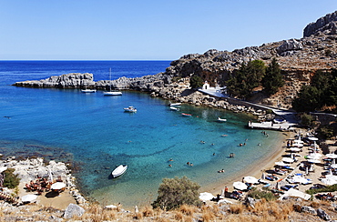 People on the beach at Agios Pavlos Bay, Lindos, Rhodes, Dodecanese Islands, Greece, Europe