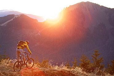 Mountainbiker riding on a trail in the Alps, Alpspitz, Bavaria, Germany, Europe