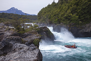 Jetboat excursion boat below Rio Petrohue Waterfall in Vicente Peres National Park, near Puerto Montt, Los Lagos, Patagonia, Chile, South America