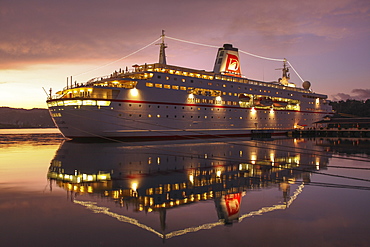 Cruise ship MS Deutschland (Reederei Peter Deilmann) in the harbour at sunset, Port Antonio, Portland, Jamaica, Caribbean