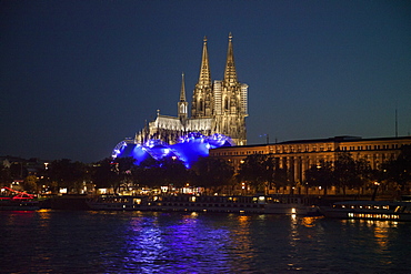 Cologne Cathedral and Cologne Musical Dome at night seen from Rhine river cruise ship MS Bellevue, Cologne, North Rhine-Westphalia, Germany, Europe