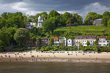 People on the beach along Elbe river, Hamburg, Germany, Europe