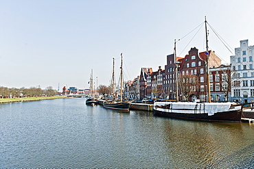 Houses with boats along the river shore, Lubeck, Schleswig Holstein, Germany