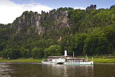 Paddle wheel steamer on Elbe river underneath the Bastei Rocks, National Park Saxon Switzerland, Elbe Sandstone Mountains, Saxony, Germany, Europe