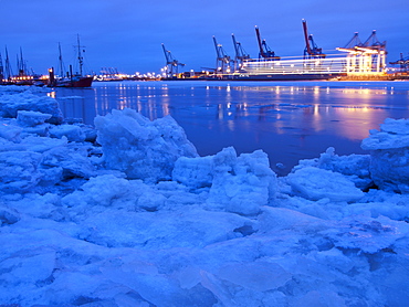 Frozen Elbe river with Waltershof container terminal in the evening, Hanseatic City of Hamburg, Germany, Europe