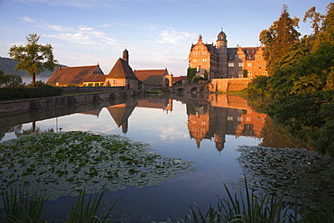 View over the pond onto Haemelschenburg castle, Emmerthal, Weser Hills, North Lower Saxony, Germany, Europe