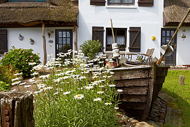 Fishing boat in front of a house at Gross Stresow, Island of Ruegen, Mecklenburg Western Pomerania, Germany, Europe