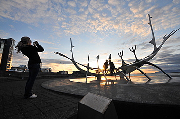 Sun voyager monument on the waterfront at dusk, Saebraut, Reykjavik, Iceland, Europe