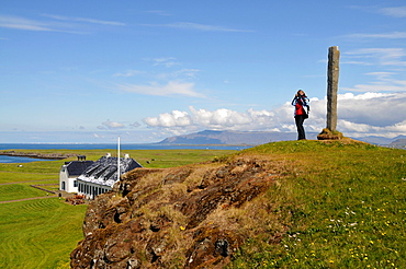 Woman on a hill, Videy island, Reykjavikurborg, Iceland