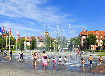 Children at the fountain at Place Rapp, Colmar, Alsace, France, Europe