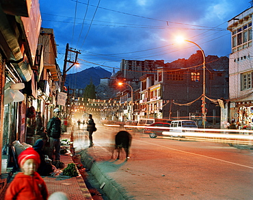 Farmer selling vegetables on the Main Bazar at main street below Royal Palace, Leh, Ladakh, Jammu and Kashmir, India