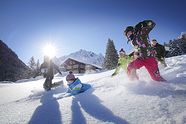 Children playing in snow, Gargellen, Montafon, Vorarlberg, Austria