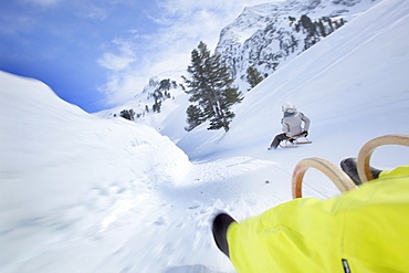 People sledding downhill, Kuehtai, Tyrol, Austria